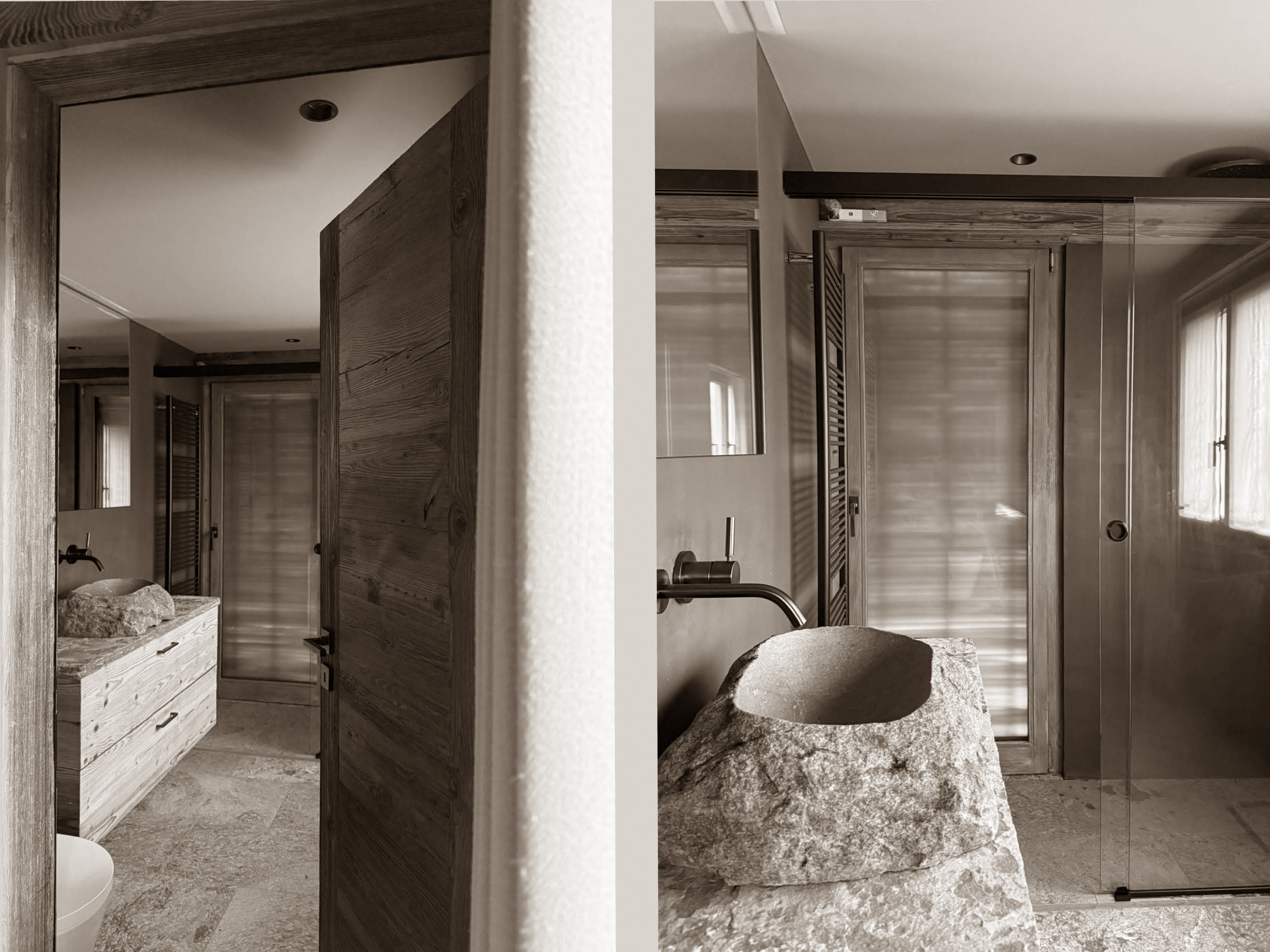 Elegant bathroom where raw natural stone meets refined craftsmanship — a sculpted basin carved from rock rests atop a textured stone vanity, complemented by matte fixtures and a sleek walk-in shower. The space blends rustic authenticity with modern sophistication.