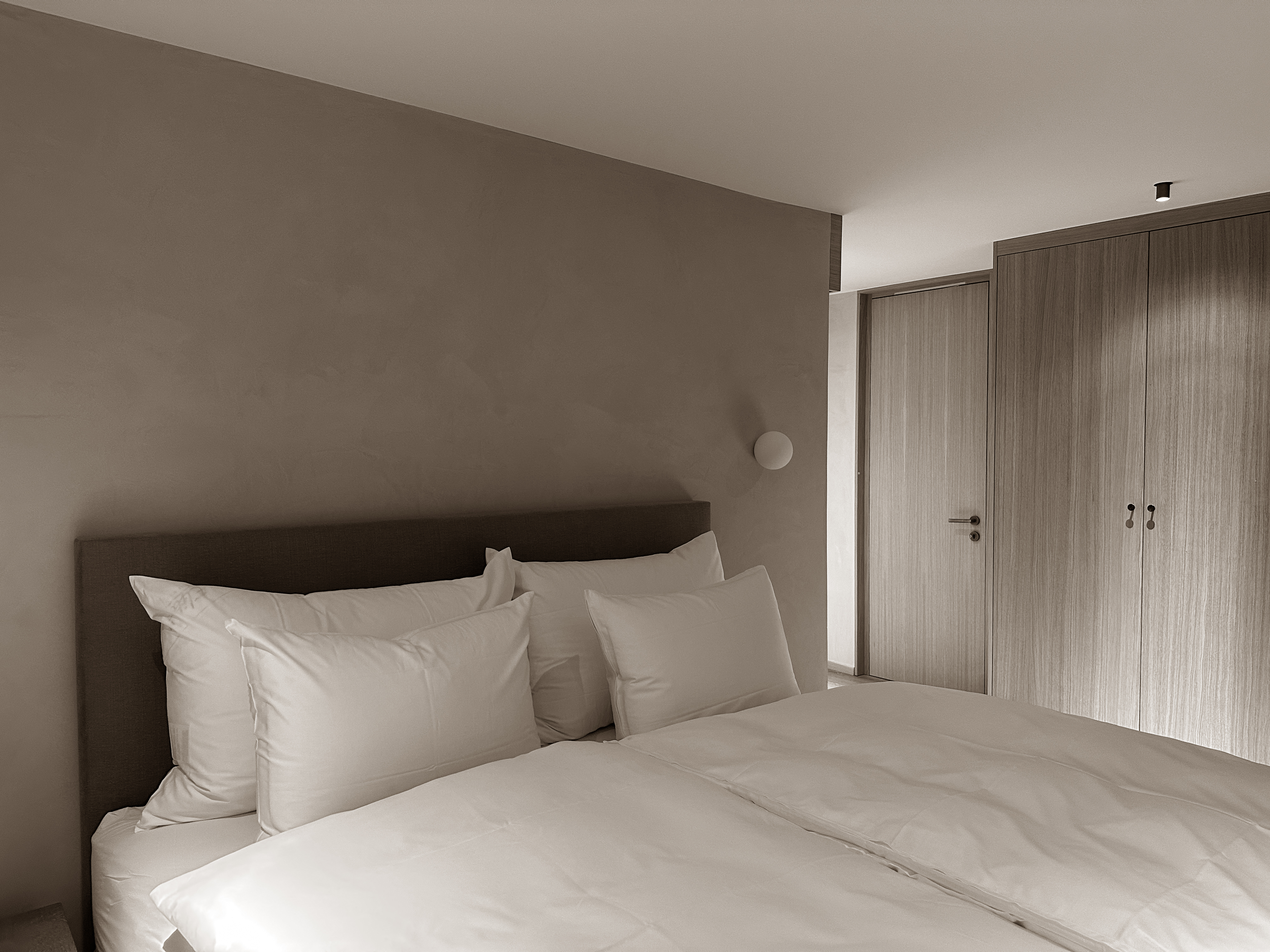 A serene bedroom with soft tones and natural textures, inviting calm and restful nights.