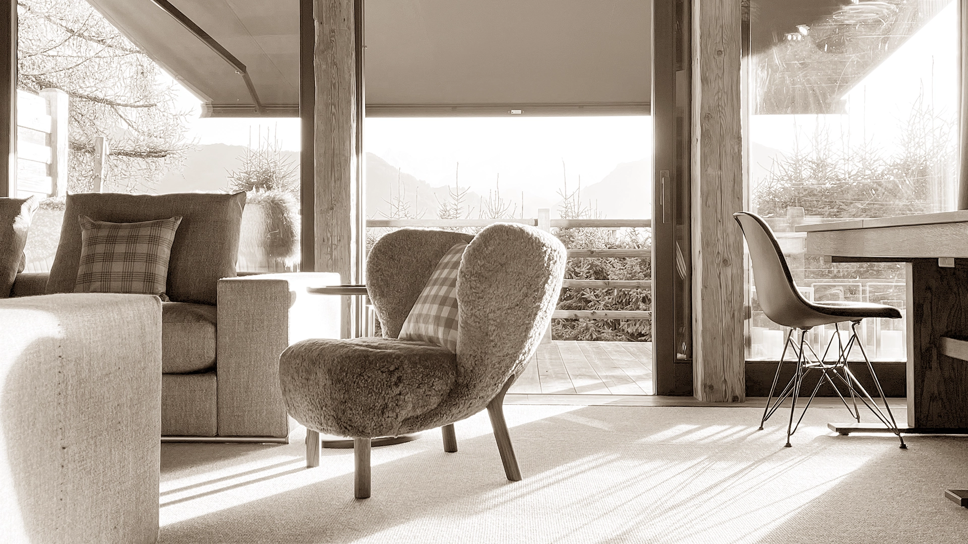 Cozy and stylish living room with modern furnishings, soft lighting, and a welcoming atmosphere, inviting visitors to connect and explore design possibilities.