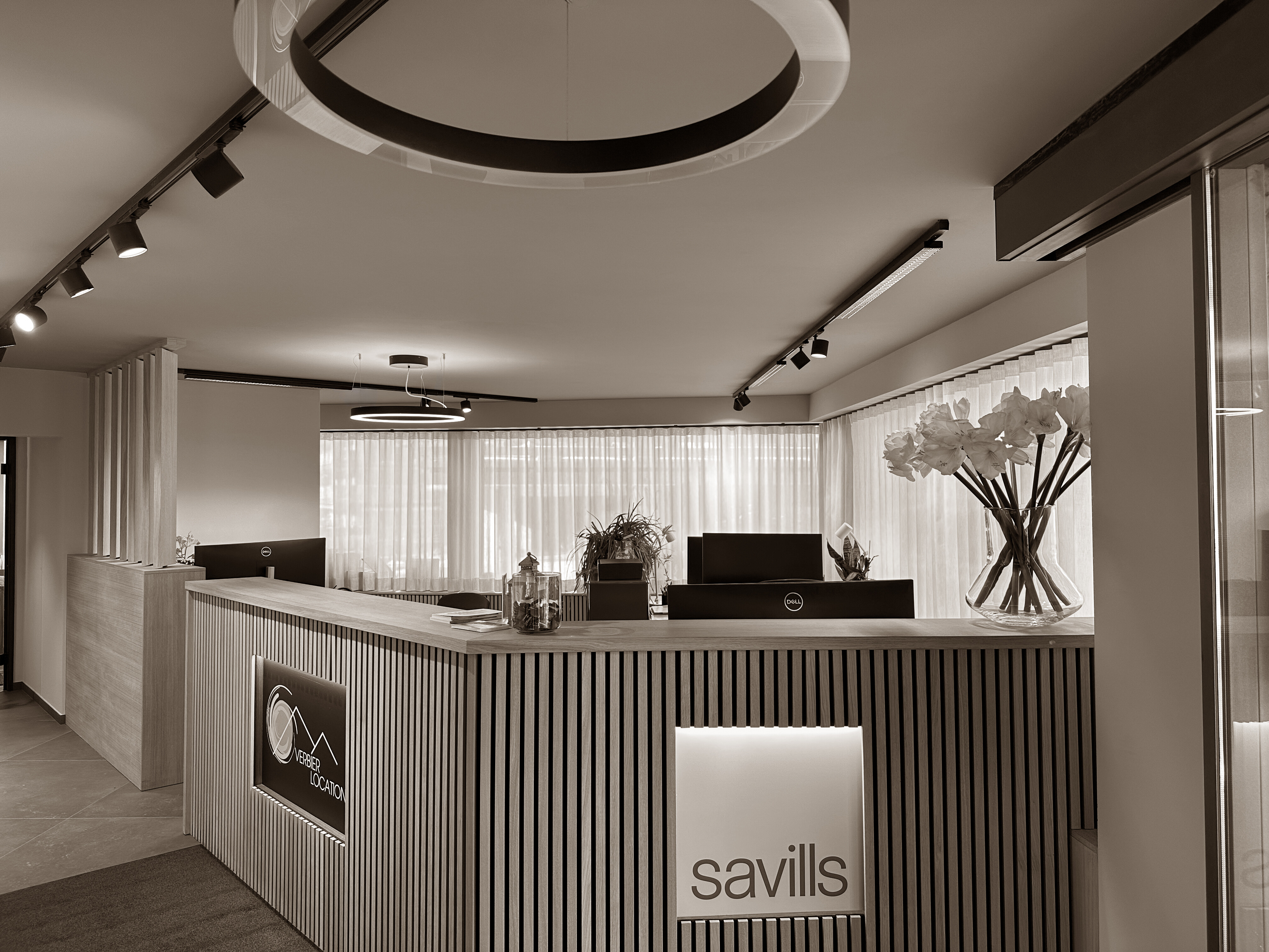 A sleek and welcoming reception area blends clean lines, natural wood, and soft lighting to create a refined and professional first impression.